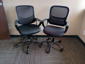2 Black rolling office chairs.  Mesh.