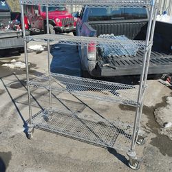 Commercial grade Mobile chrome wire shelving unit, also known as a baker's rack with wheels 5'x18"x4"W