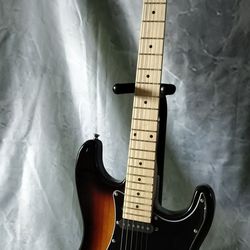 Brand new electric guitar with new bag and cable