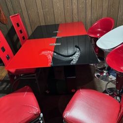 black and red modern dining table with 4 chairs .