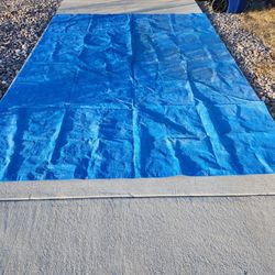 tarp
11'5"x9'2"
one side has red sprayed
little tear
not bad in overall
