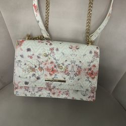 white floral purse with gold handle 