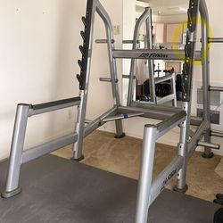 Life Fitness Olympic Squat Rack + (3) 45 lb Plates