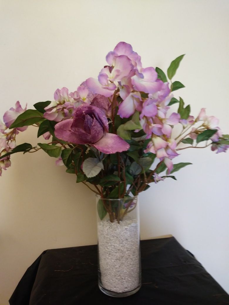 Purple flowers in a cylinder vase