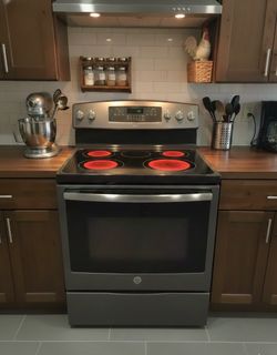 Dark stainless steel stove has  air fryer oven