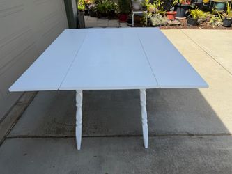 WHITE  WOODEN  TABLE with FOLDING  SIDE  PANELS
