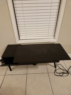 Extended coffee table with compartments