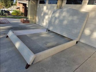 Like new beautiful eastern king upholstered bedframe