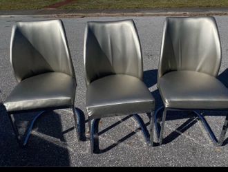 3 modern leatherette dining chair with a chrome sled base space silver color.