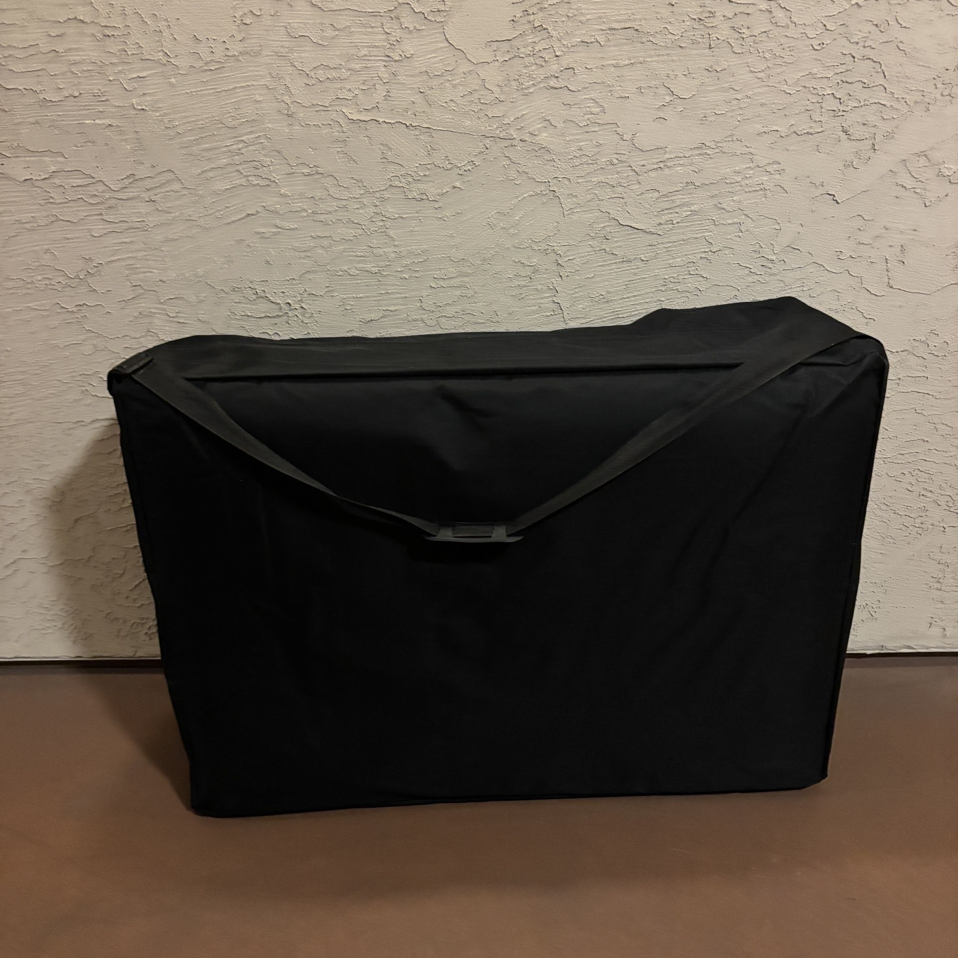 One Black Massage Table With accessories and Black Carrying Case