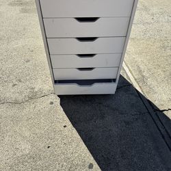 A white dresser for beginner nail tech hairstylist, lash techs