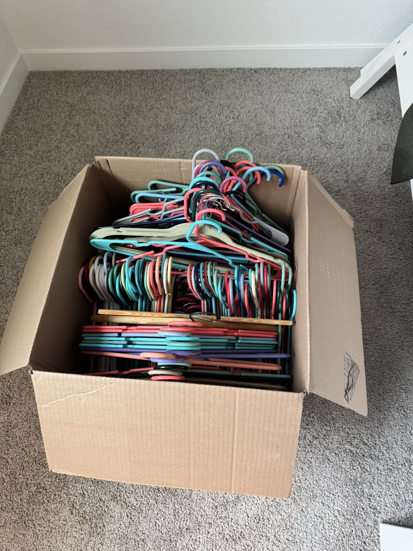 Large Box Of Colorful And White Hangers For Free