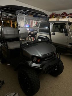 LIKE NEW EZGO Golf Cart – 4 Passenger – Lithium Battery – Only a Few Miles!