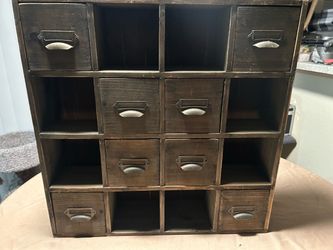vintage-style wooden apothecary or card-catalog style