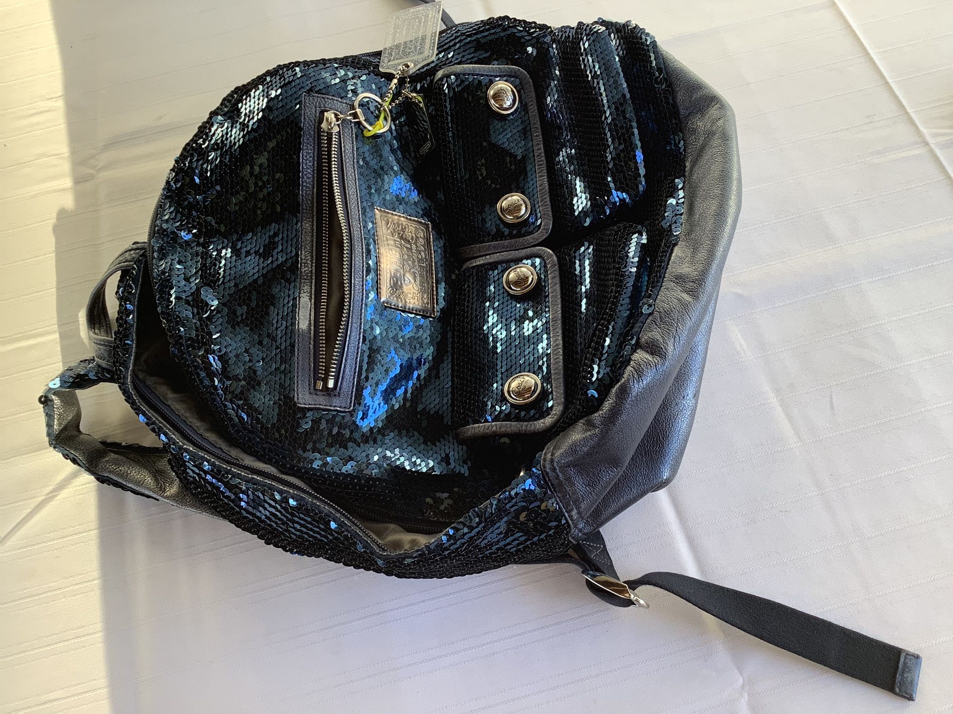 リュック・バックパック Coach blue poppy sequin backpack limited Coach blue poppy sequin backpack limited - メルカリ