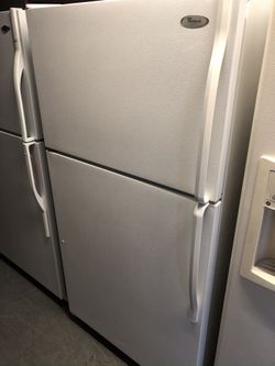 Used whirlpool top and bottom fridge. 1 year warranty