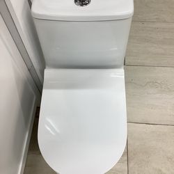 One piece toilet new white color Softclose seat with fully skirted dual tornado flush system ready for pick up today