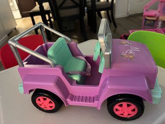 The item shown is the American Girl WellieWishers Garden Adventure Wheels toy jeep