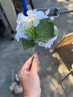 Rustic metal vase with flowers
