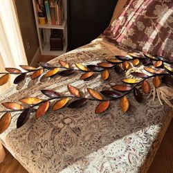 2 Metal wall decorations 49 in long. 