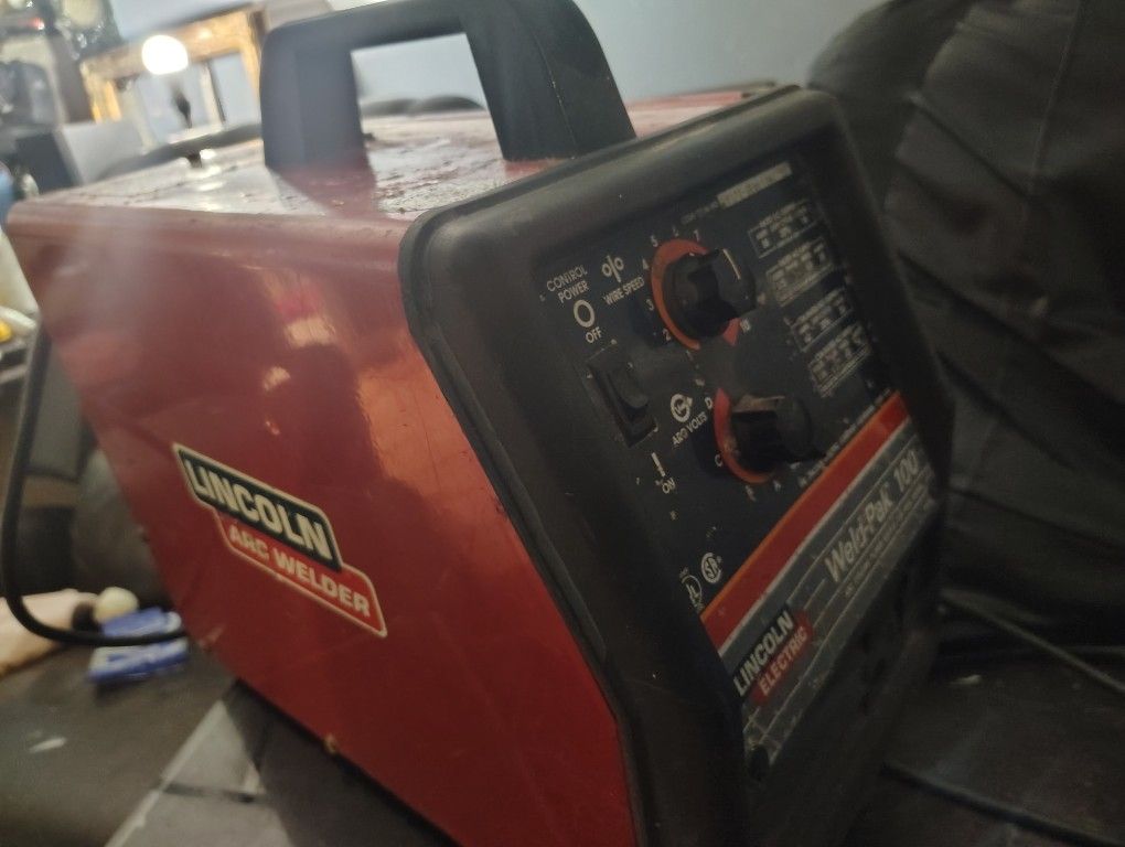 red Lincoln Electric Weld-Pak 100 MIG welder.