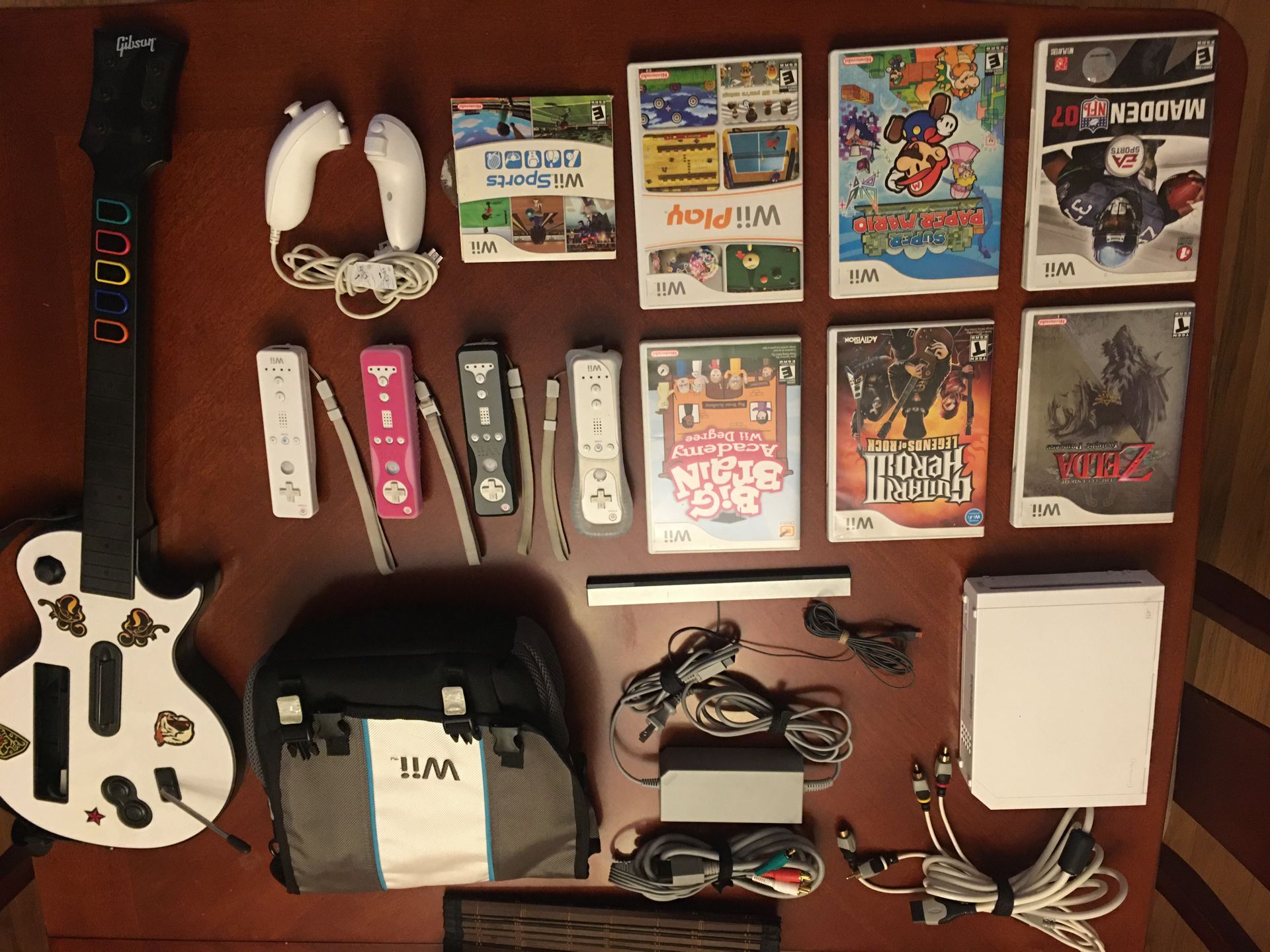 Nintendo WII with guitar, games and case