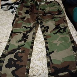 Women's clothes size x large 2 pants n one crochet dress n silver blouse camouflage pants n dressy blk pants