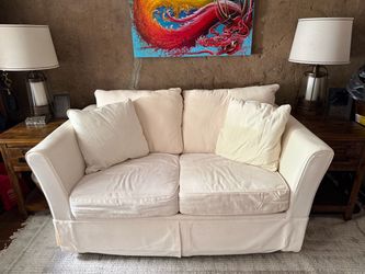 Cream colored sleeper Love seat -Twin Size