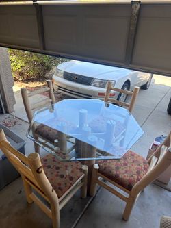 8 sided glass dining table and 4 chairs