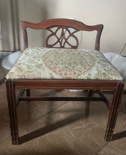 Vintage Chippendale style wood vanity bench seat with floral upholstery