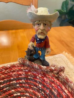 Southwest ceramic cowboy statue on coiled and sewn rope basket. Fun accent ! Cabin / rustic/ cottage