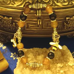 Honeybee charm bracelet.
Black  opsidian and lemon quartz size medium