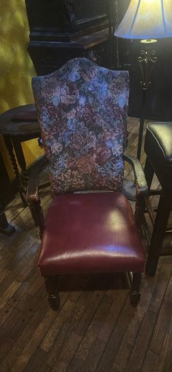 Vintage floral tapestry and burgundy armchair with arm rest