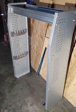 Cargo van shelf with tool hooks