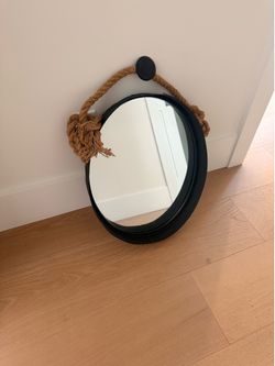 Round black mirror with rope hanger