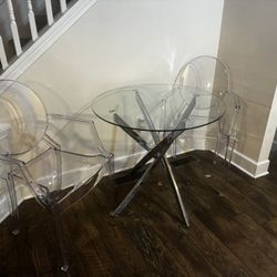 Glass Table With Two Clear Chairs