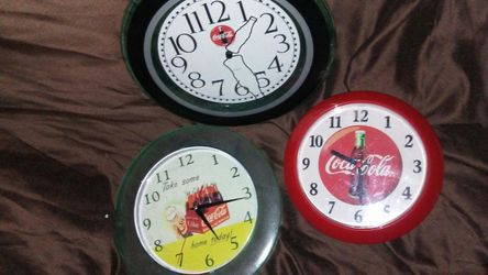 Various Coca-cola wall clocks