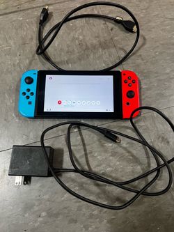 Nintendo Switch with Neon Joy-Cons and Charger