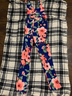 Floral jumper bodysuit with spaghetti strap and criss cross straps back details