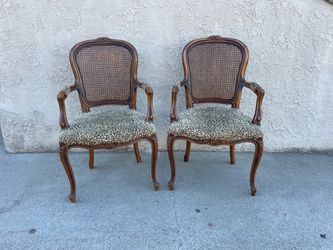 A pair of vintage French Regency armchairs