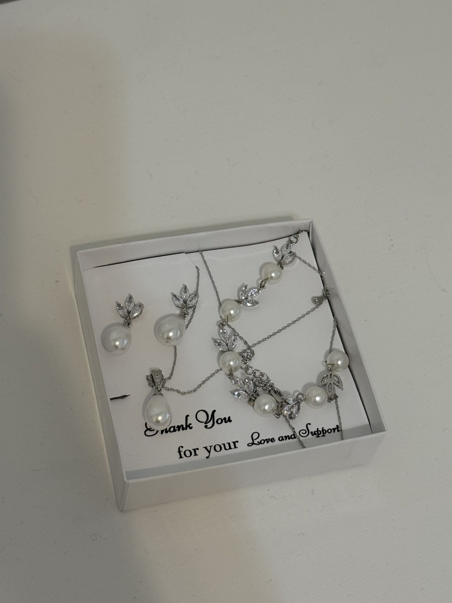 BRAND NEW. Necklace, earrings, and bracelet matching set.