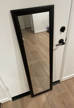 Over-the-door mirror at approx 51.5" × 15.5".