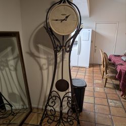Howard Miller grandfather clock solid wrought iron with rock face