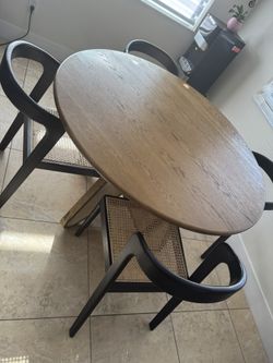 Modern Round Wood Dining Table with 4 Cane-Back Chairs