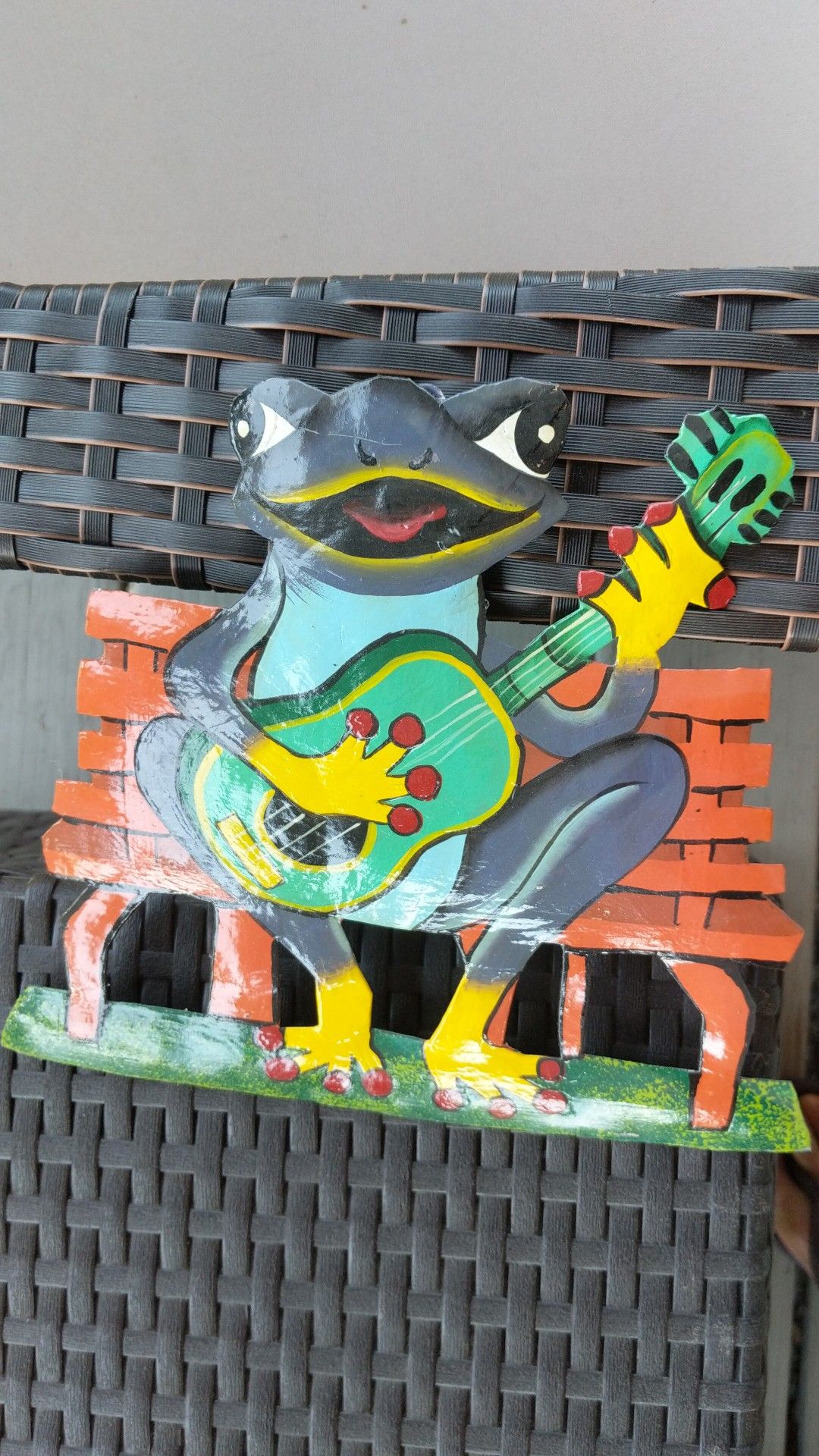 Metal art work, painted frog playing guitar