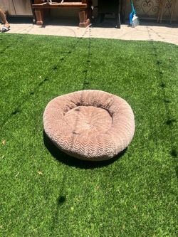 Brown circular dog bed