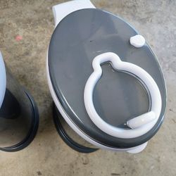 Two Ubbi Diaper Bins