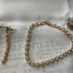 2 pairs of gold tone earrings and bracelet with crystals 