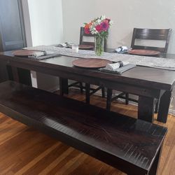 Dining room table, bench and chairs.