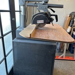 Rockwell delta 10 Inch Deluxe Radial Arm Saw On Caster Wheels Cabinet Table 